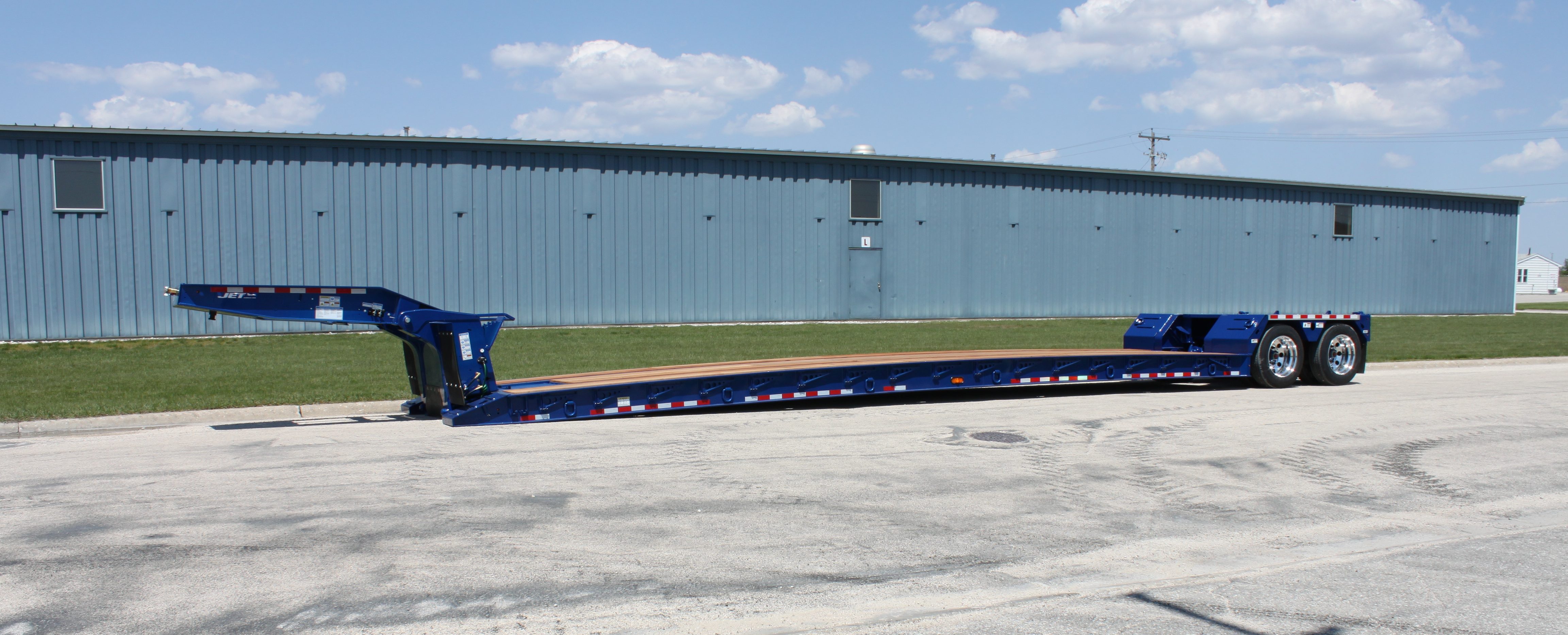 BlueTandemAxleLowboyTrailer. Jet Co Trailers