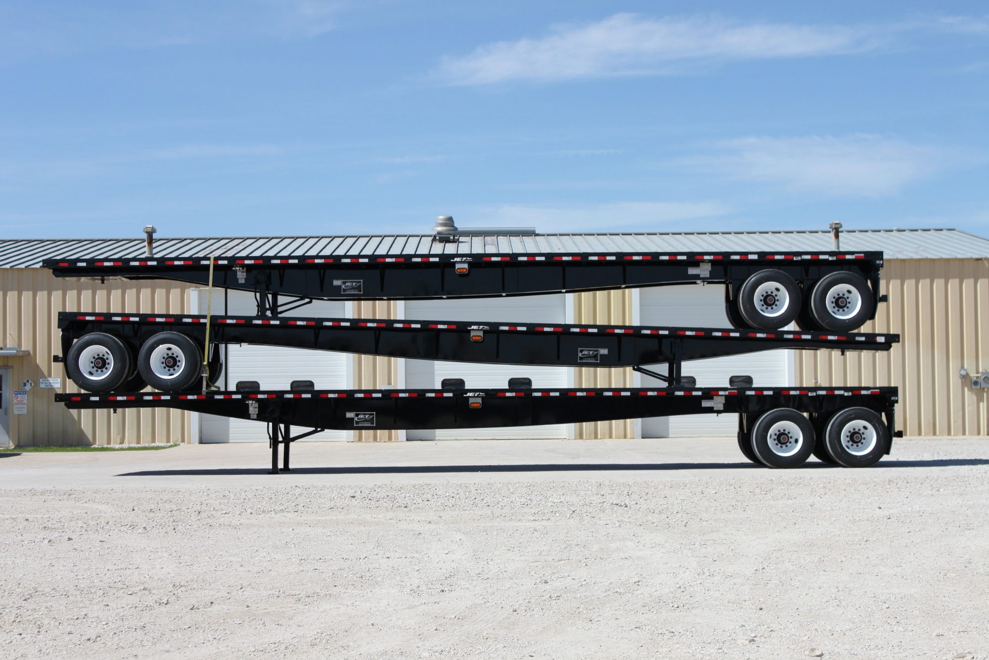 SteelFlatbedTrailersThreeStackedsideview Jet Co Trailers